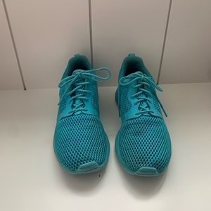 Used blue Nike athletic shoes